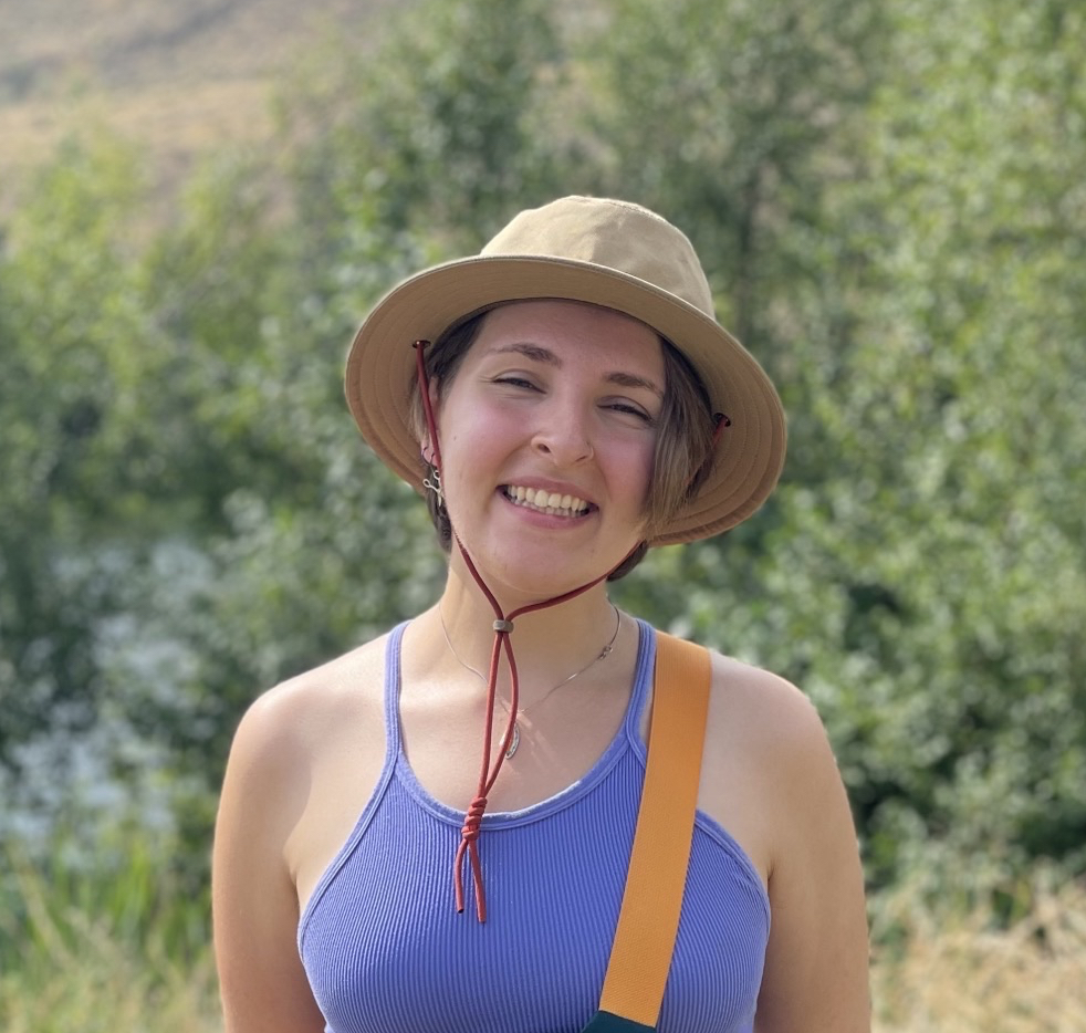 Smiling girl in tan summer hat
