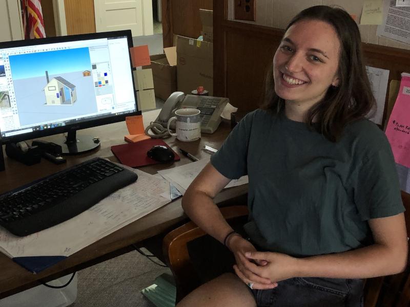Student Olivia Kaulfus with their model for a tiny home