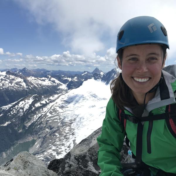 Lindsey MacDonald smiles on a mountain hike